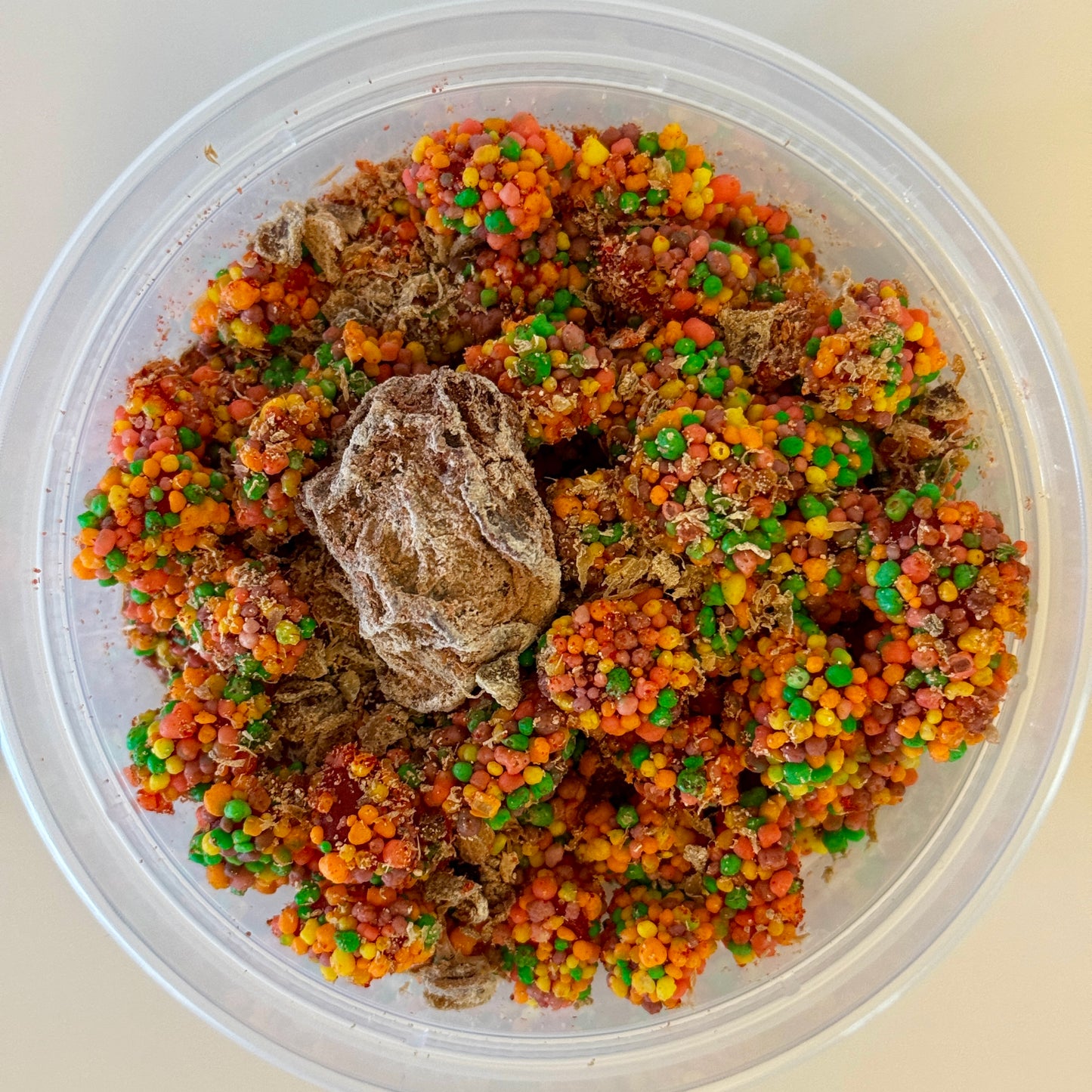 Aunty Kendra's Crunchy Clusters: Gummy clusters covered in colorful crunchies, dusted with Li Hing Mui powder and lemon peel.