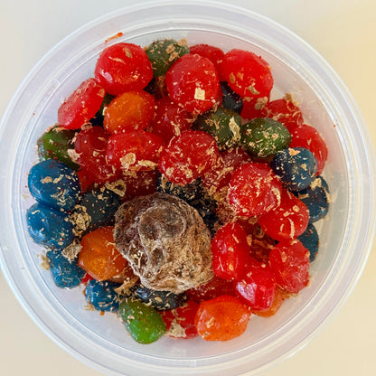 Aunty Kendra's Juicy Bursts: Fruit snacks with a liquid center, coated in signature Li Hing Mui powder and lemon peel.