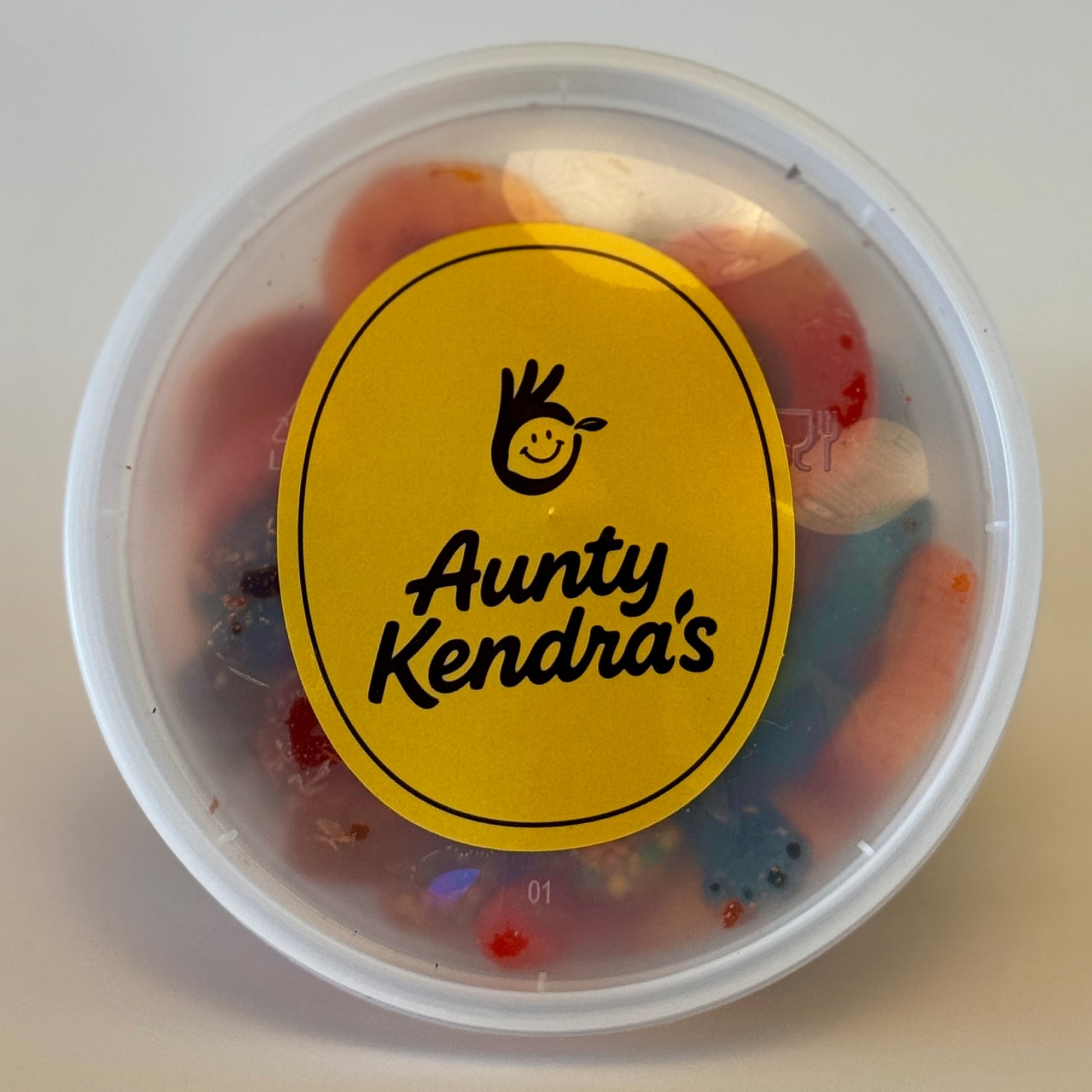 Aunty Kendra's Kamikaze Mix: Assorted gummy worms and rings covered in sweet and sour Li Hing Mui powder.